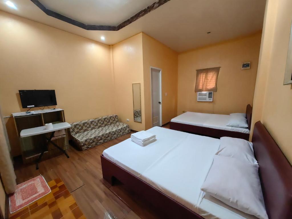 Postel nebo postele na pokoji v ubytování Lagnason's Place