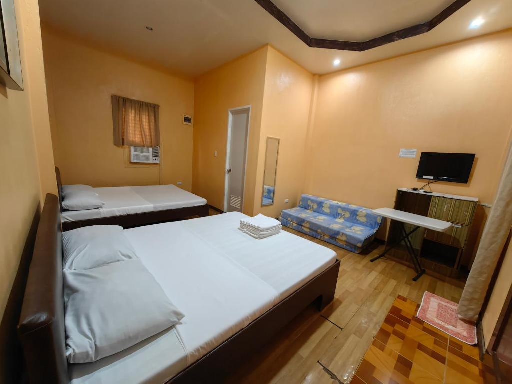 Postel nebo postele na pokoji v ubytování Lagnason's Place