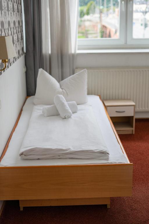 Postel nebo postele na pokoji v ubytování Hotel Constantin