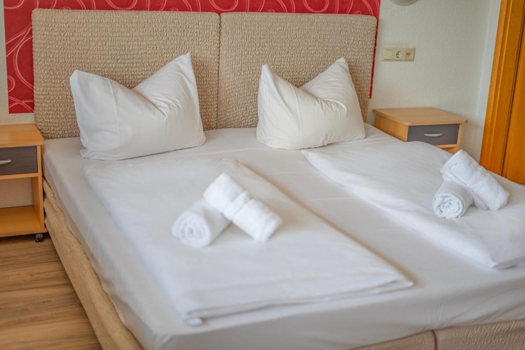 Postel nebo postele na pokoji v ubytování Hotel Constantin