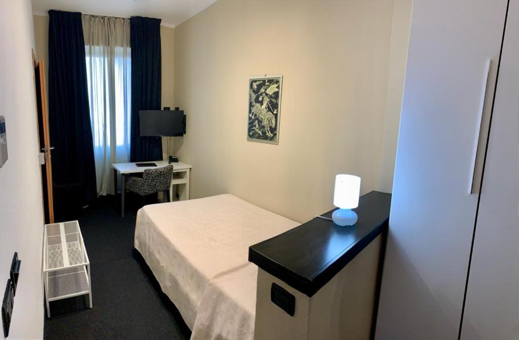 Postel nebo postele na pokoji v ubytování Hotel Bella 'Mbriana