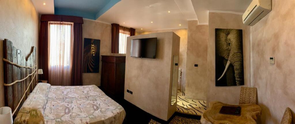 Postel nebo postele na pokoji v ubytování Hotel Bella 'Mbriana