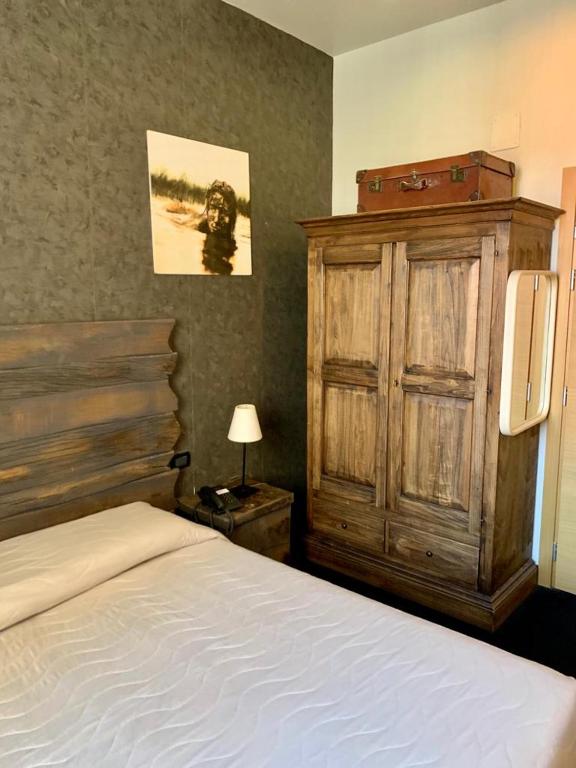Postel nebo postele na pokoji v ubytování Hotel Bella 'Mbriana