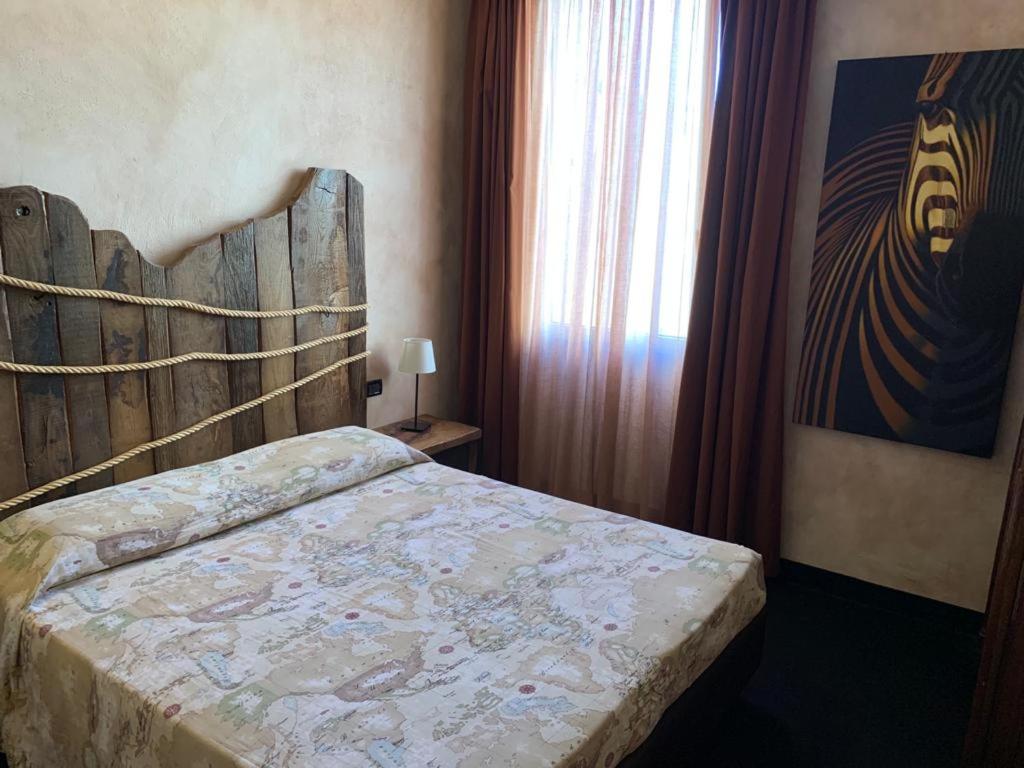 Postel nebo postele na pokoji v ubytování Hotel Bella 'Mbriana