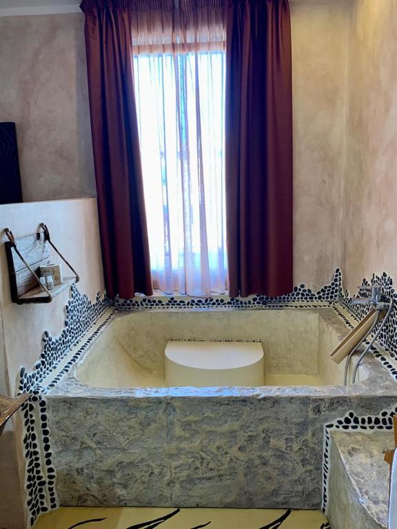 Koupelna v ubytování Hotel Bella 'Mbriana