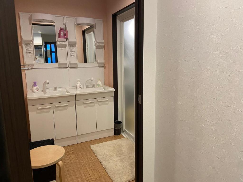 a bathroom with a sink and a mirror at Higashi Shimbashi Building 3F Hostel Gion SORA - Vacation STAY 92728v in Kyoto