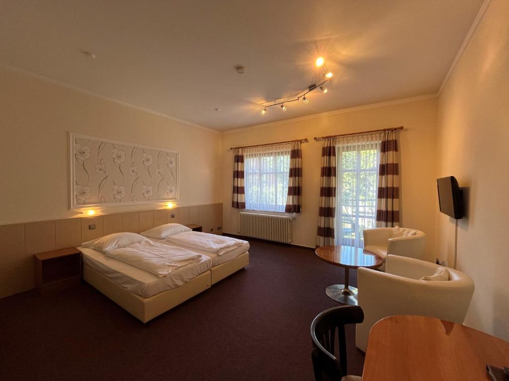 Postel nebo postele na pokoji v ubytování Hotel Liszt