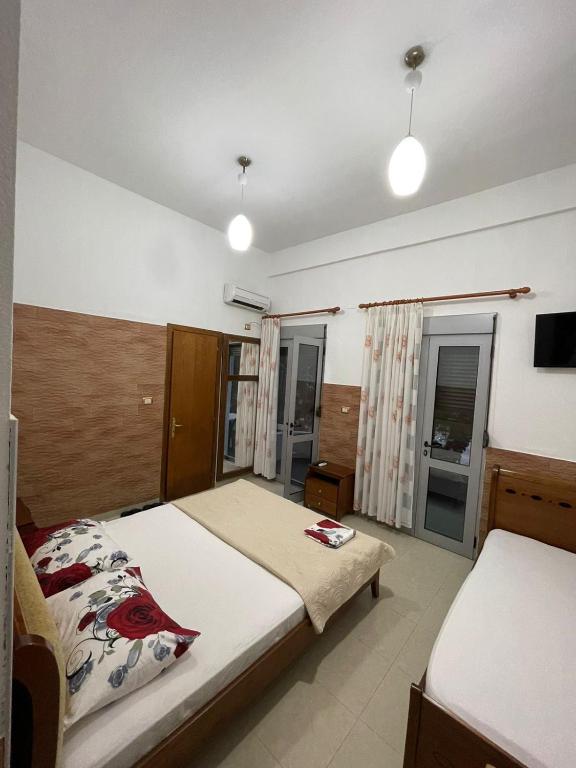 Postel nebo postele na pokoji v ubytování Guest House Kocollari