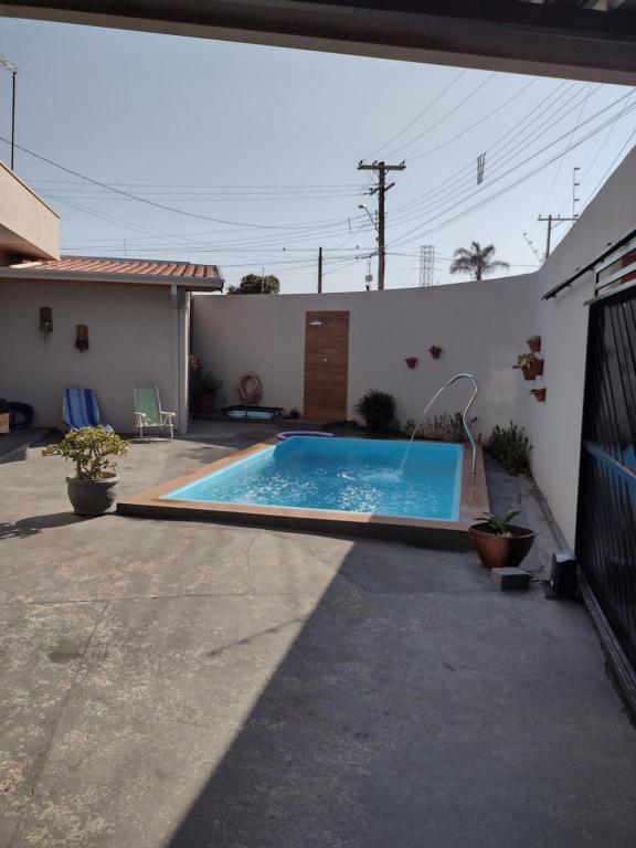 a swimming pool in the backyard of a house at Casa Mariano in Brotas