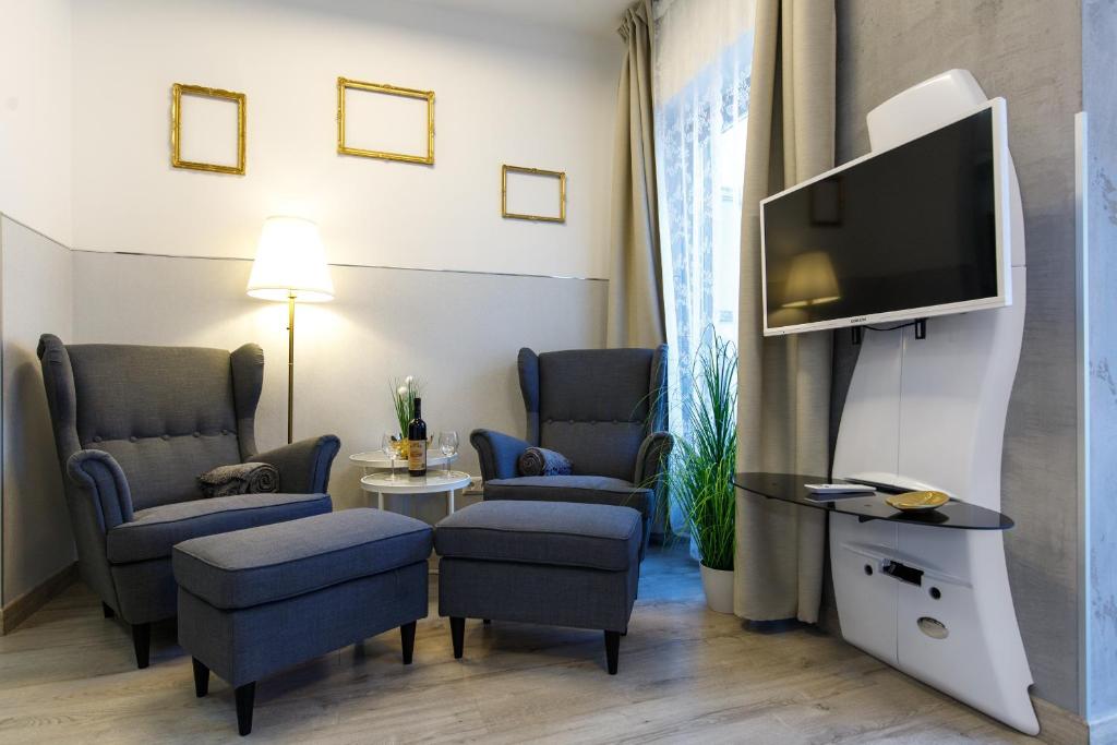 Televízia a/alebo spoločenská miestnosť v ubytovaní K40 Romantic Deluxe Studio In the City Center