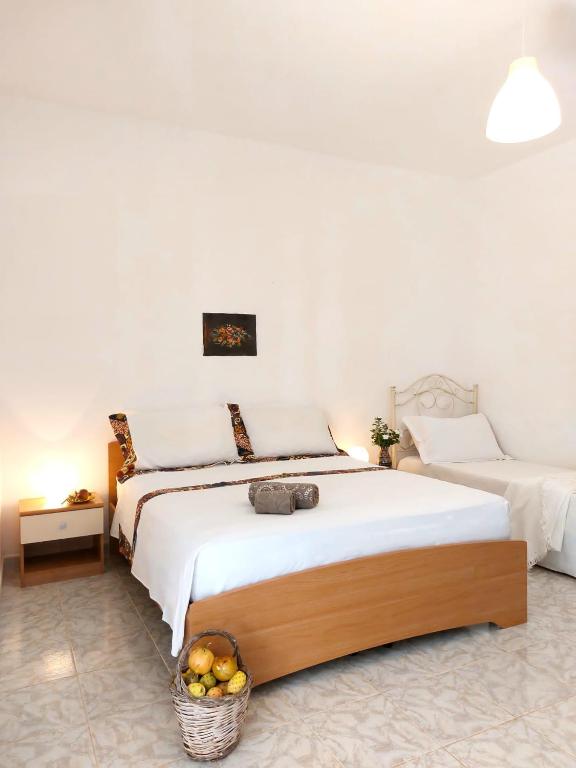 Łóżko lub łóżka w pokoju w obiekcie Villa Luigi