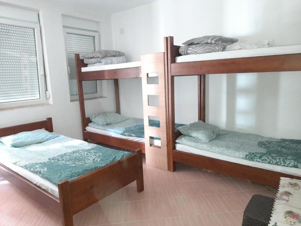 Postel nebo postele na pokoji v ubytování Apartman Osmancevic