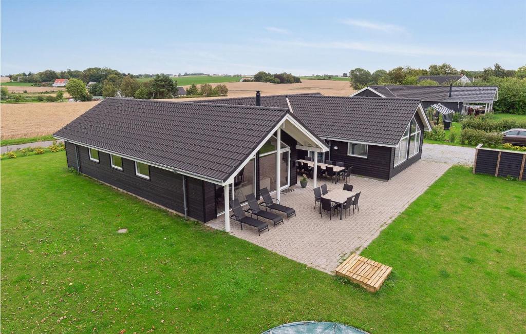 an overhead view of a black house with a patio at Amazing Home In Stege With Sauna in Stege