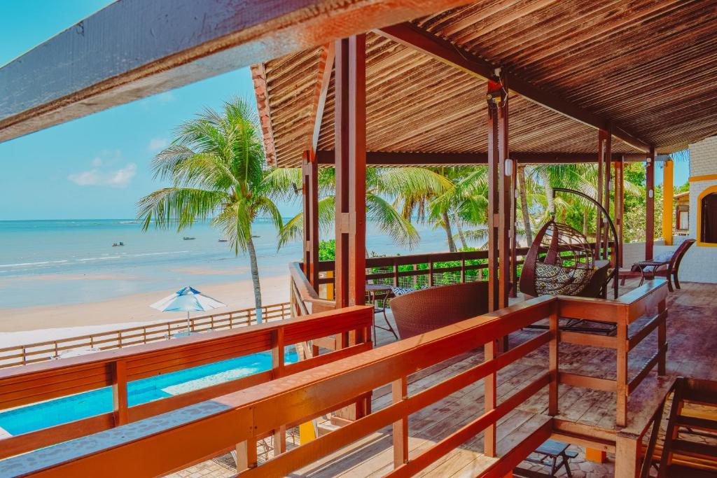 a resort balcony with a view of the beach at Pousada Estrela da Luz Beach in Ceará-Mirim