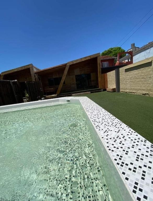a swimming pool in front of a house at str_on 2 in Encarnación