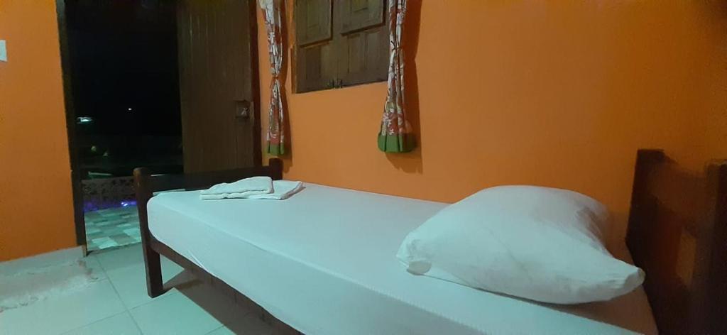 Postel nebo postele na pokoji v ubytování ROSÁRIO TEMPORADA Hostel