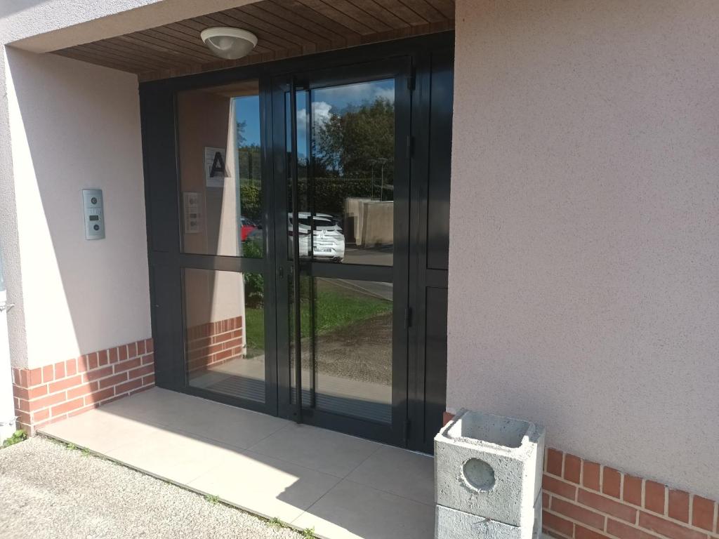 an entrance to a building with a glass door at résidence la clairière aux portes de la baie de Somme in Abbeville