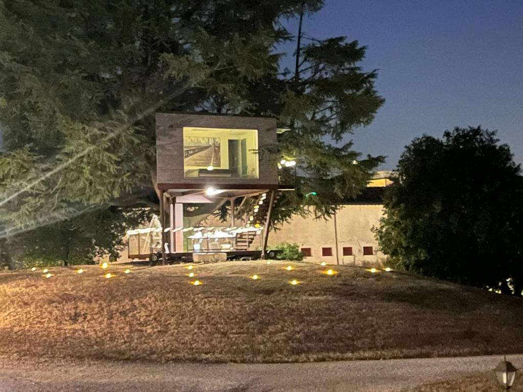 a small house with lights on the yard at night at Villa San Biagio Residence in Mason Vicento