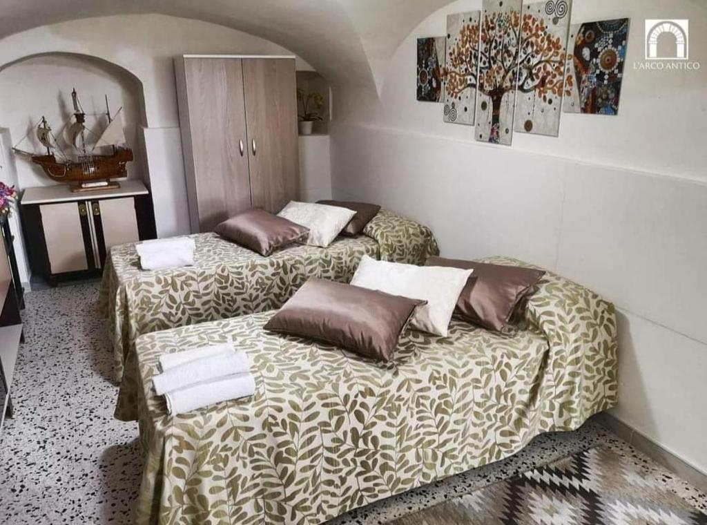 Postel nebo postele na pokoji v ubytování Arco Antico