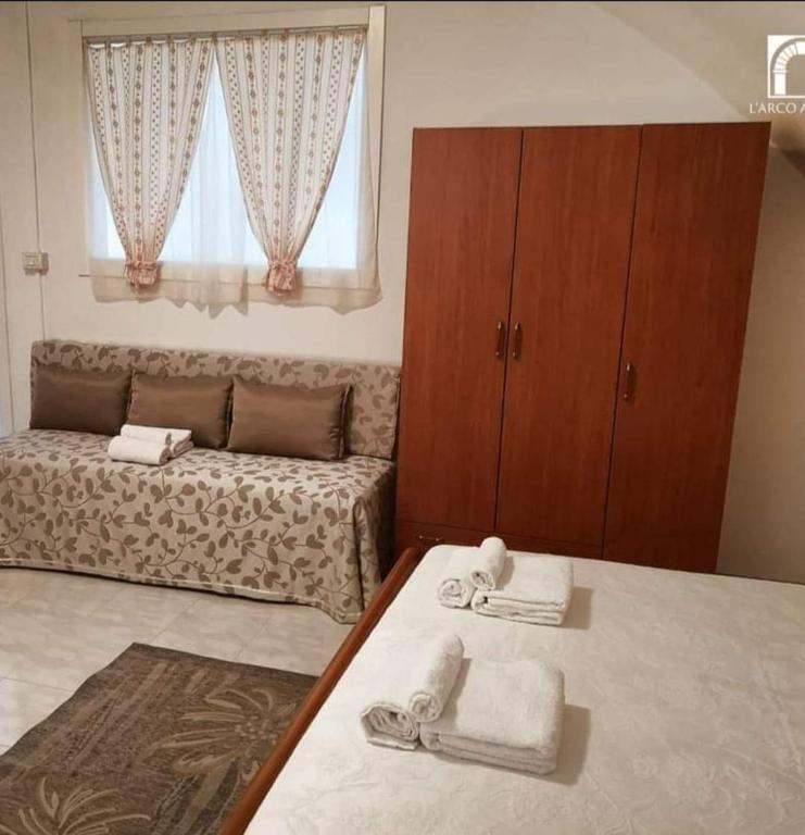 Postel nebo postele na pokoji v ubytování Arco Antico