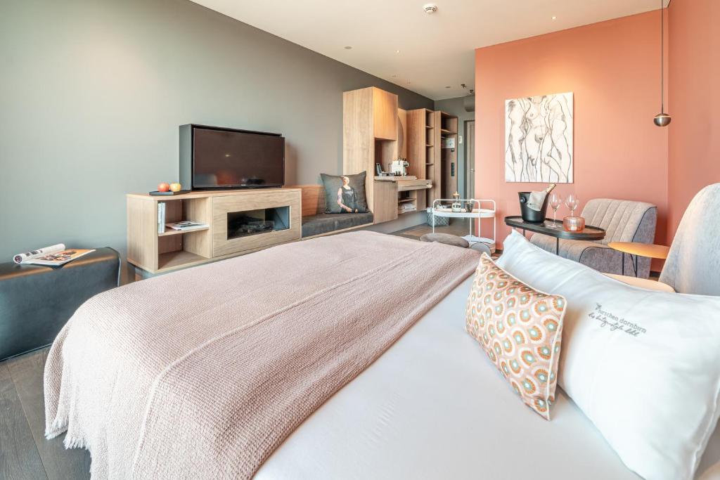 TV a/nebo společenská místnost v ubytování hirschen dornbirn - das boutiquestyle hotel