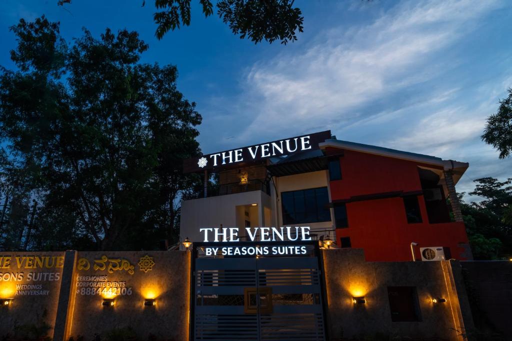 a building with a sign that reads the vivere by seasons suites at THE VENUE by Seasons Suites in Dod Ballāpur
