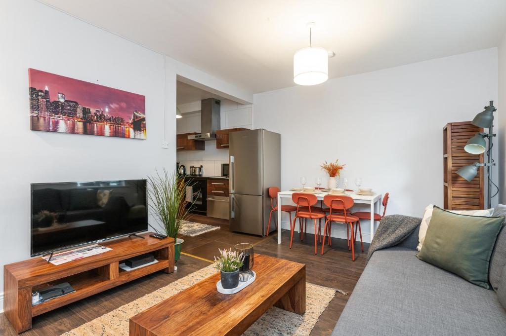 a living room with a couch and a table at Lovely 2-bed apartment in the heart of Dublin City in Dublin