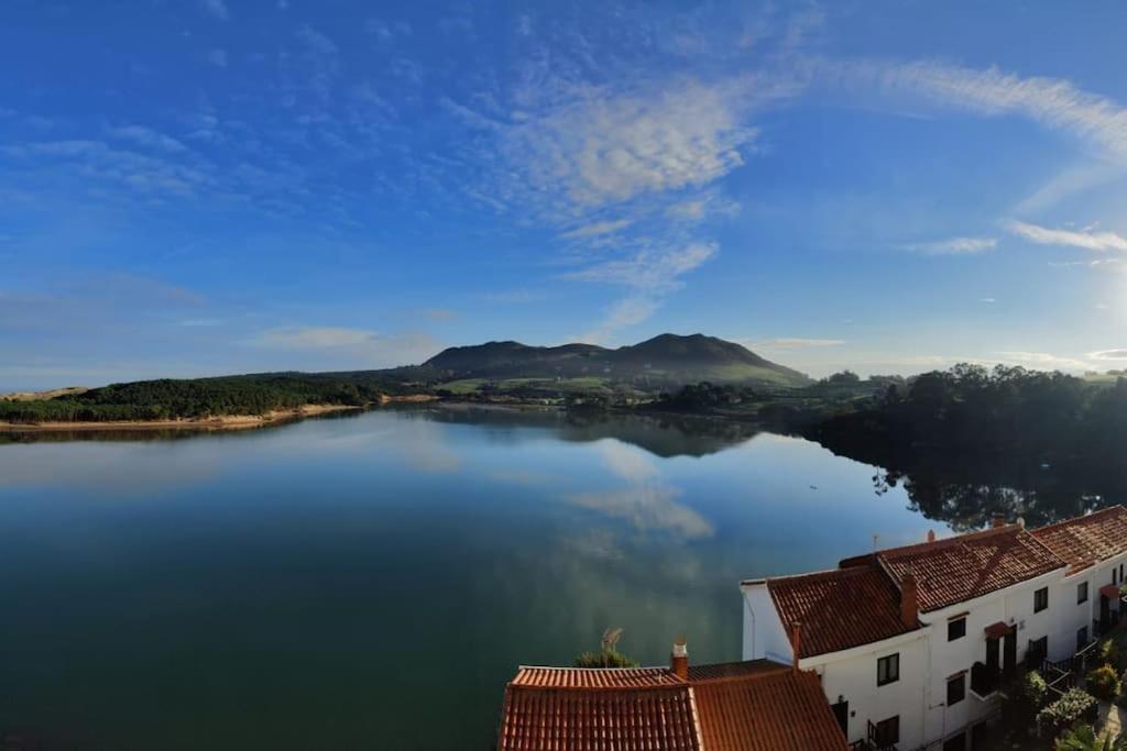 a view of a large lake with houses and buildings at IAROS Pueblo del Sol in Mogro
