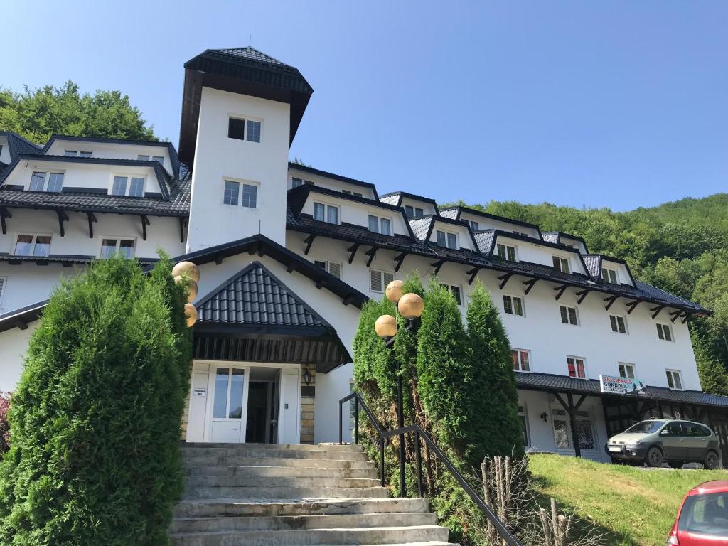 a building with stairs in front of it at Planinski Raj - Bela Reka Gondola in Brzeće