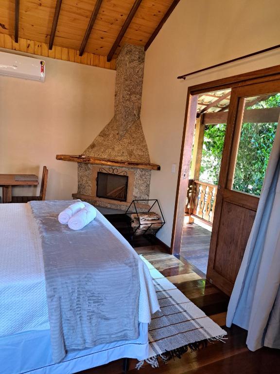 Postel nebo postele na pokoji v ubytování Pousada Vale da Cachoeira