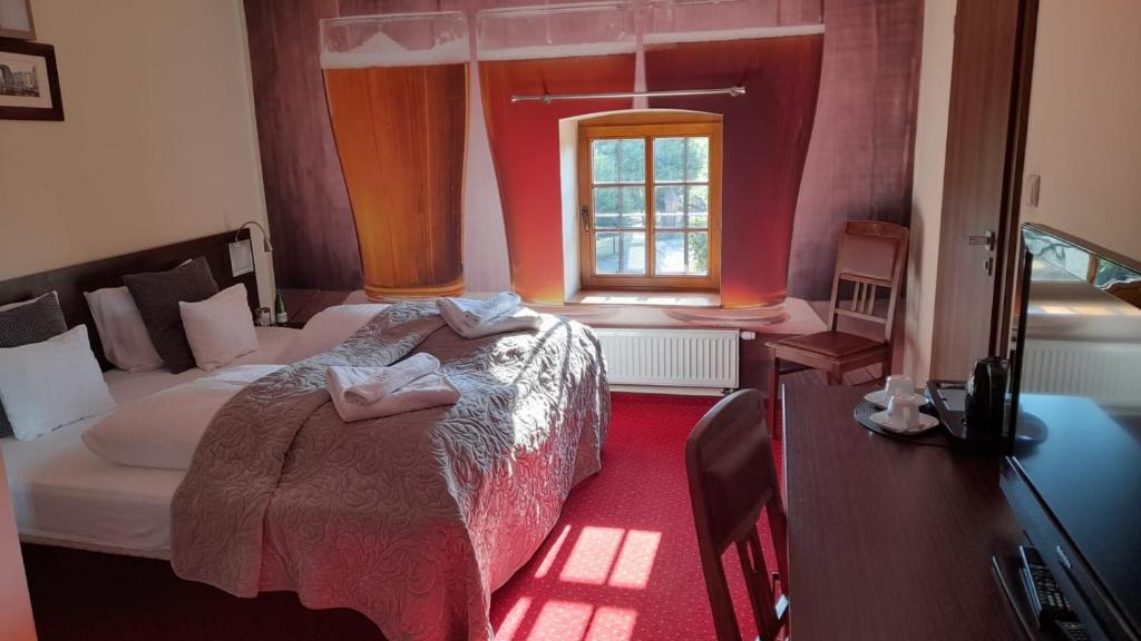 Posteľ alebo postele v izbe v ubytovaní Hotel Spichrz