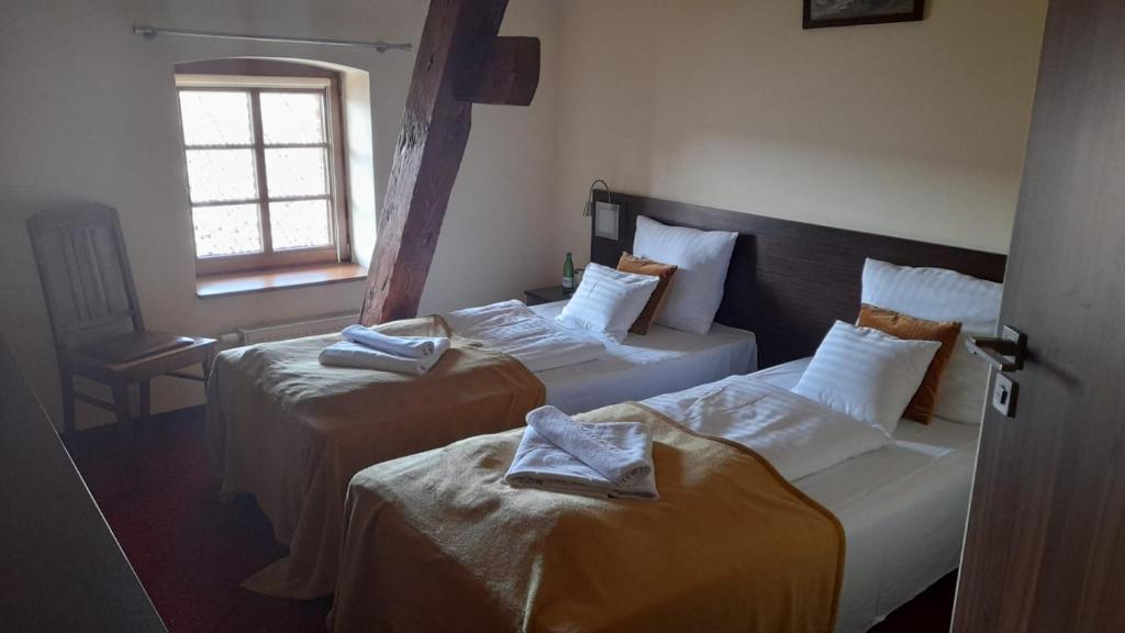 Posteľ alebo postele v izbe v ubytovaní Hotel Spichrz