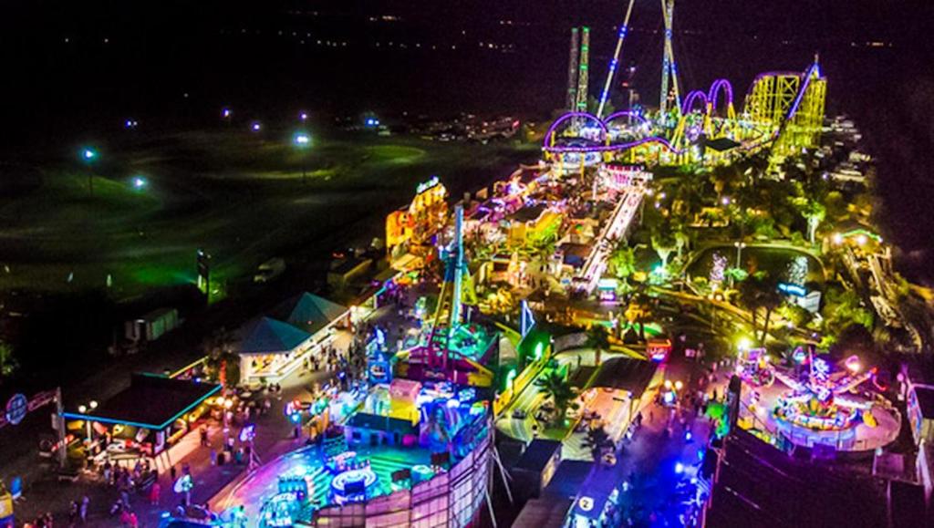 an overhead view of a carnival at night at Bungalow de 3 chambres avec piscine partagee et terrasse a Vias a 1 km de la plage in Vias