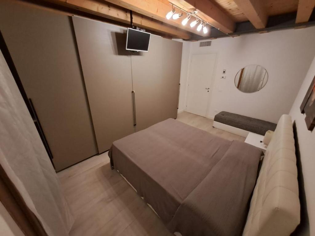 a small room with a bed and a couch at Central Luxury Garden guest house in Mestre