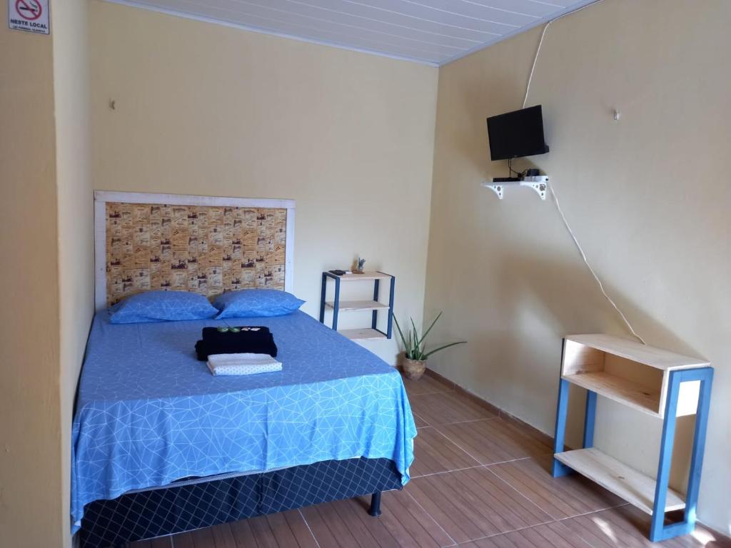 Кровать или кровати в номере Pousada raio de sol