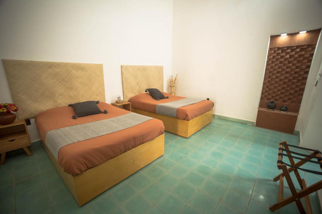 Postel nebo postele na pokoji v ubytování Casa Sofi Oaxaca
