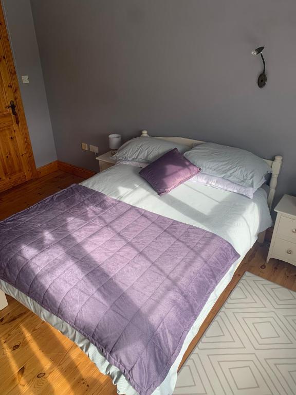 Postel nebo postele na pokoji v ubytování Garrenmore Lodge B&B