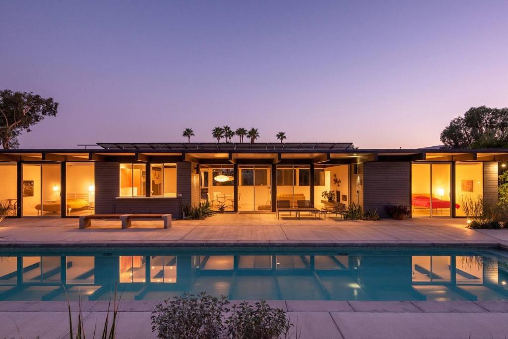 a house with a swimming pool in front of it at The Milky Way Modern Desert Retreat in Borrego Springs