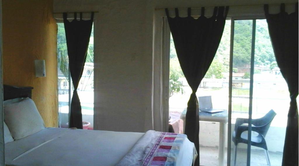 Postel nebo postele na pokoji v ubytování Bahia B&B