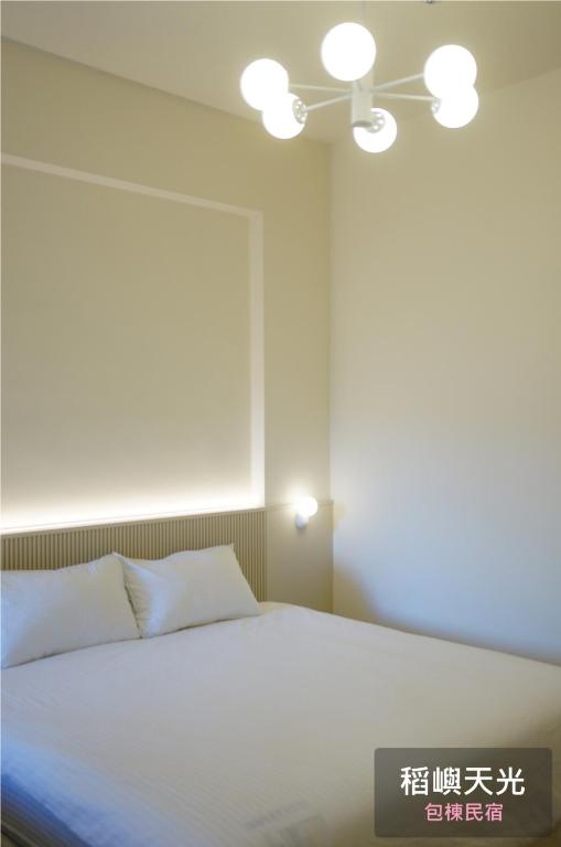 Letto o letti in una camera di 稻嶼天光包棟民宿