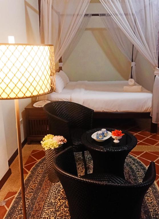 Postel nebo postele na pokoji v ubytování Siam Tara Resort Chiangkhong