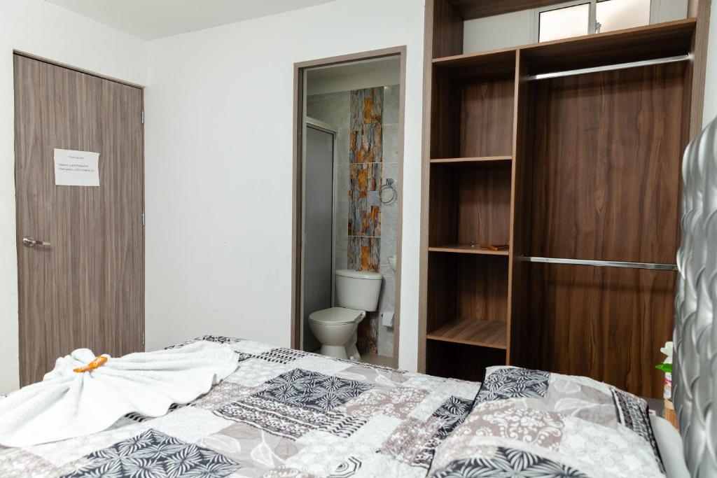 Postel nebo postele na pokoji v ubytování Apartaestudios Galanni