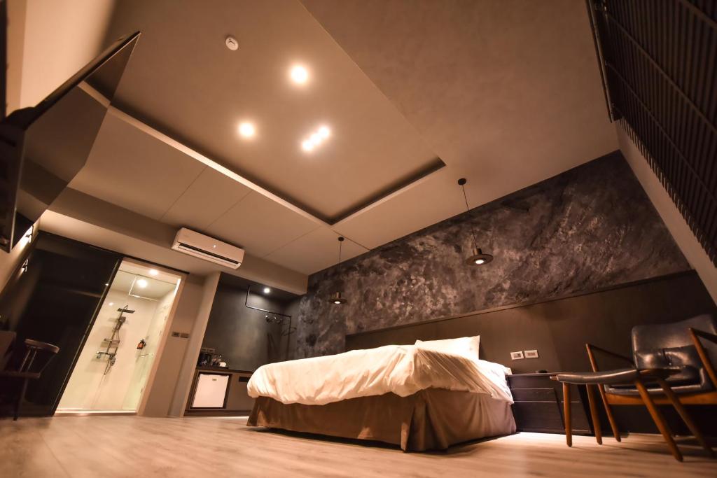 Postel nebo postele na pokoji v ubytování Two Couples Leisure Art Motel