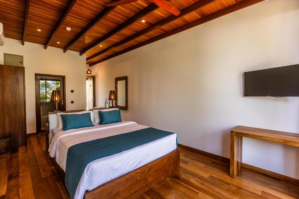 Voodi või voodid majutusasutuse BK Beach Boutique Hotel - Hikkaduwa toas