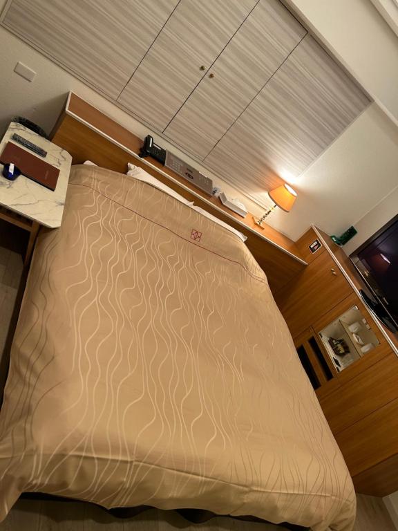Voodi või voodid majutusasutuse Hotel AKAIKUTSU - Adult Only toas