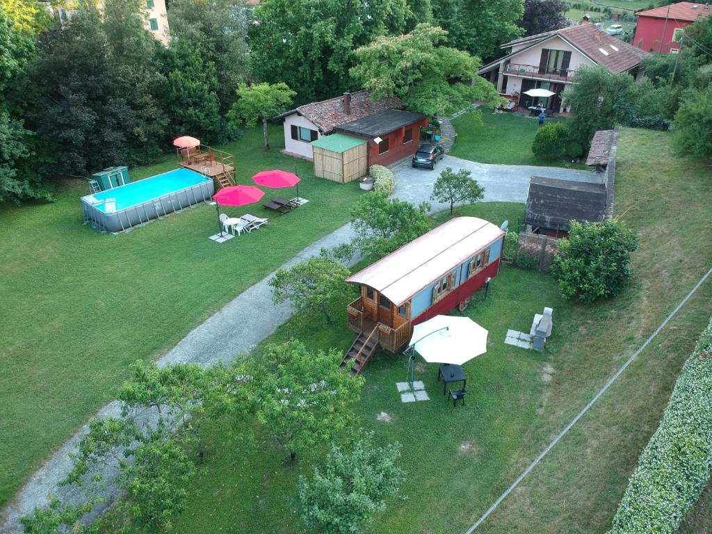 an aerial view of a backyard with a house and a building at I Tre Abeti - Holiday House in Vezzano Ligure