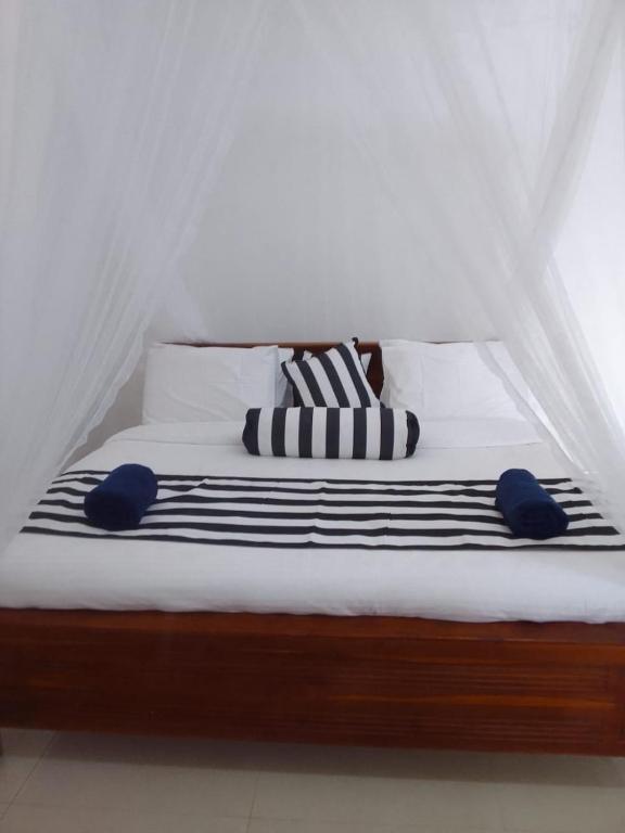Postel nebo postele na pokoji v ubytování Sadew Home Stay