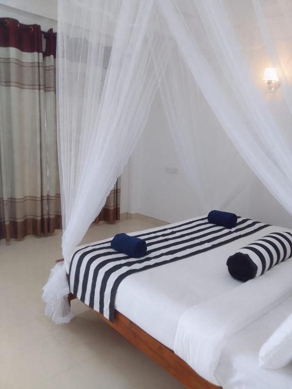 Postel nebo postele na pokoji v ubytování Sadew Home Stay
