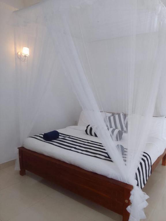 Postel nebo postele na pokoji v ubytování Sadew Home Stay