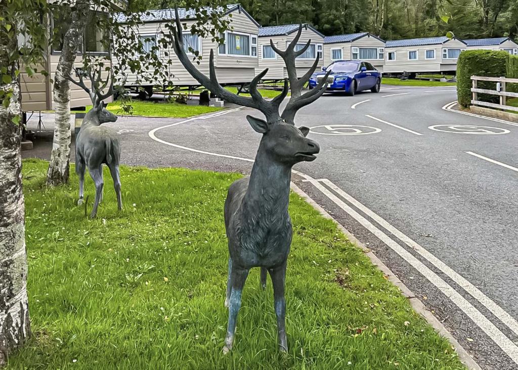 a statue of a deer on the side of a road at Lemonford Caravan Park in Bickington
